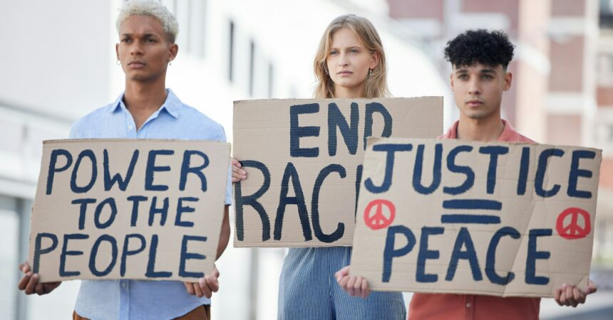 Protest, crowd and poster of peace, racism and justice in city street rally, fight and human rights