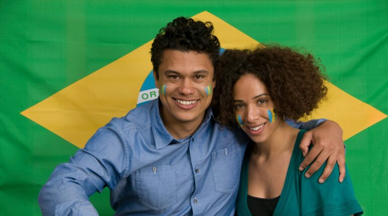 Couple smiling with Brazilian flag