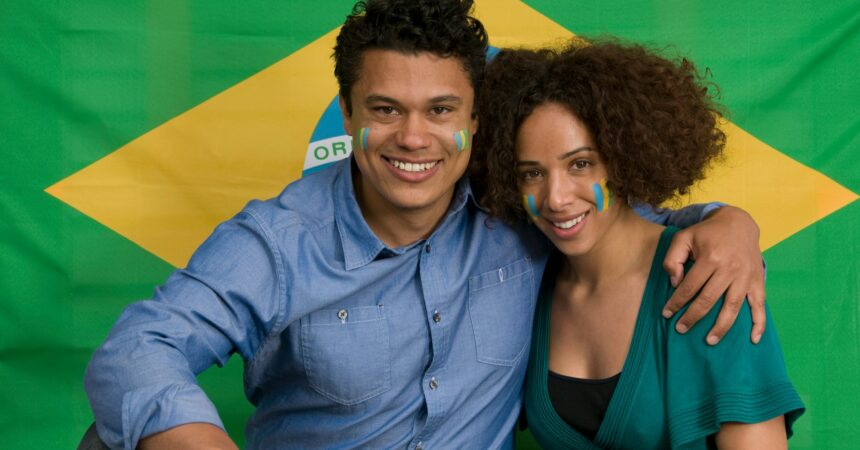 Couple smiling with Brazilian flag